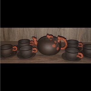 Vintage Chinese Yixing teapot clay set with tea, cups and saucers from